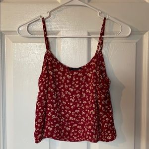 Cropped, flowy shirt with pale, tan flowers